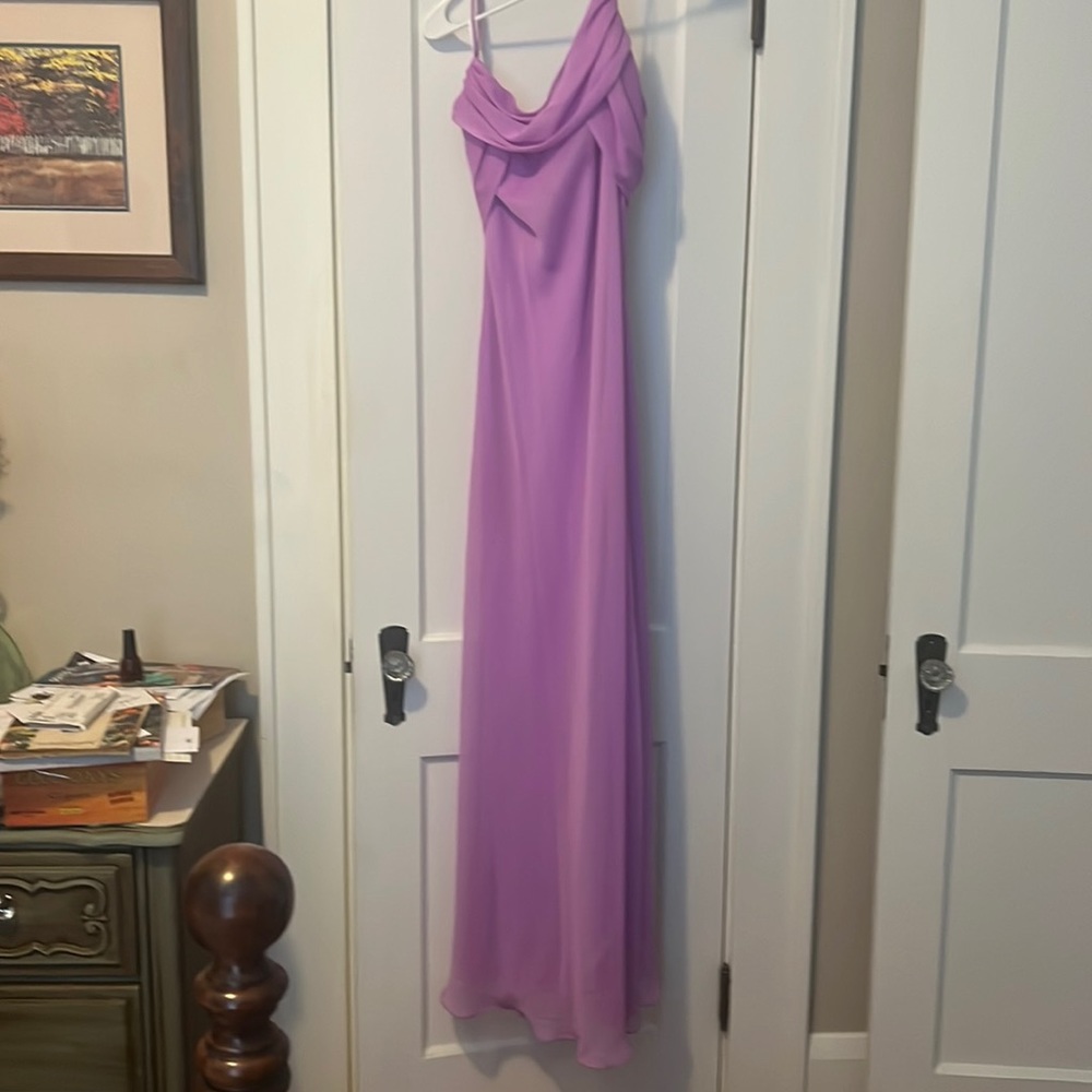 Formal lavender dress has large on the ticket but it fits a size 4 new w/tags